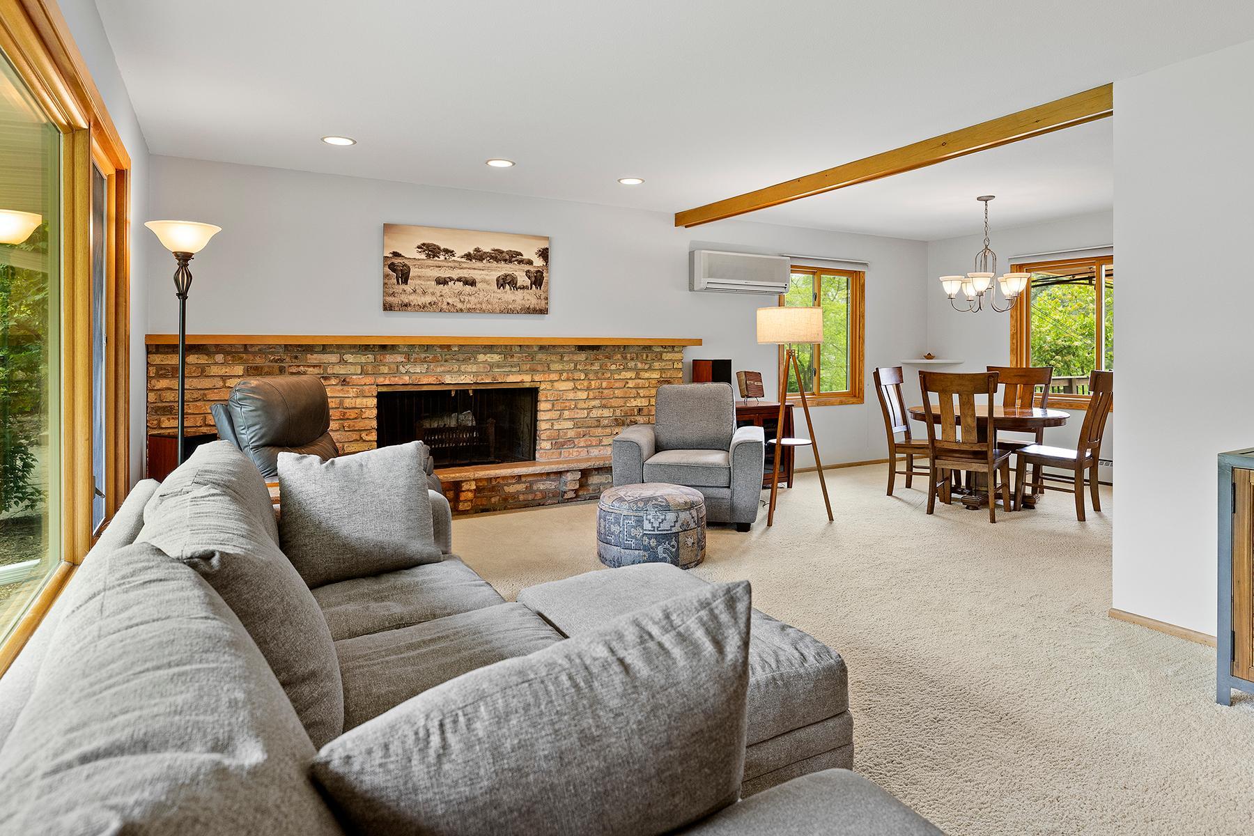 Beautiful Open Living Room with Brick Fireplace
