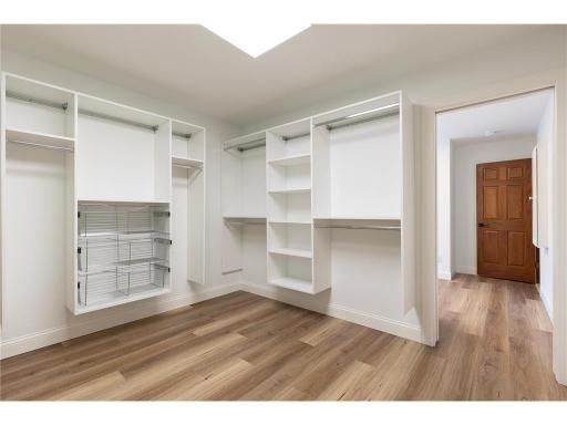 Ensuite large and organized walk-in closet.