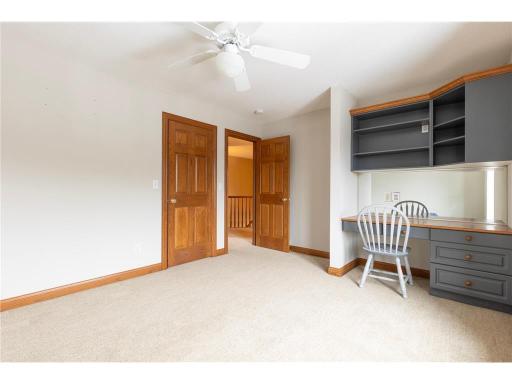 Large second upstairs bedroom with built-in desk.