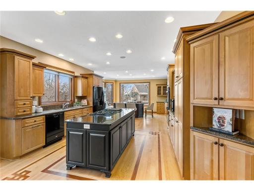Stunning large kitchen with wood shaker cabinets...