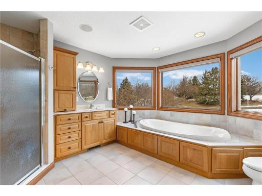 Ensuite garden tub overlooking grounds and river....