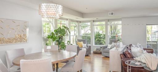 Gigantic great room with wall to wall wood flooring and abundant lighting