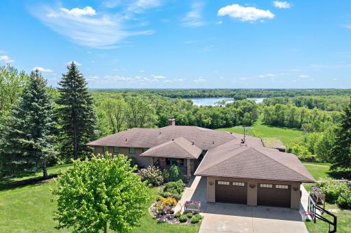 Welcome to 8705 Chester Ave. Situated on a ridge overlooking nearly 100 acres of pristine forest, fields and wetland. Views to the lake from nearly every window in the home!