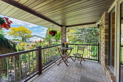 Northwest facing porch looks over the expansive front yard and entrance.