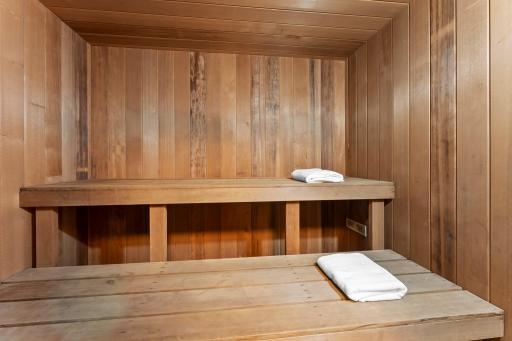 Basement bath features large sauna with electric heating element.