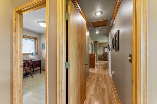 Small front Office, or Den on the Main Level offers a Front Facing Window to oversee the Pole Buildings and Front Yard. Perfect Spot for an Office, Sewing or Craft Room. Hardwood Flooring introduces the Primary Suite on the Main Level.