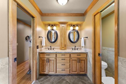 Dual Sinks with Granite Countertops, Tile Flooring, Updated Lighting and Mirrors.