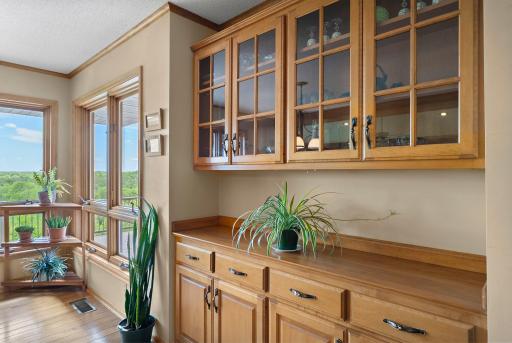 Spacious built ins provide ample storage and beautiful glass cabinets to store your treasured glassware.