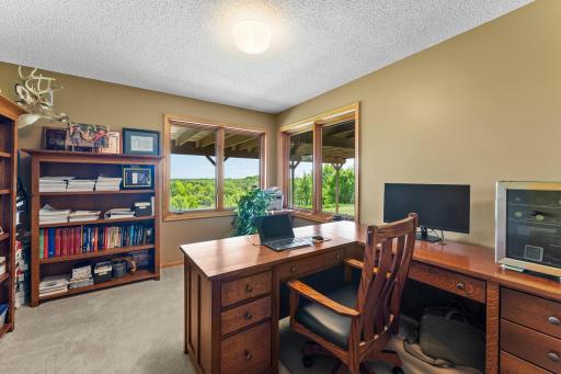 Bedroom 5 on lower level, currently used as an office, has the signature corner windows. This room does not have a built-in closet.