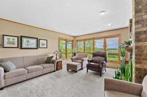 Across from the dining space is a beautiful main floor family room with wood burning fireplace.