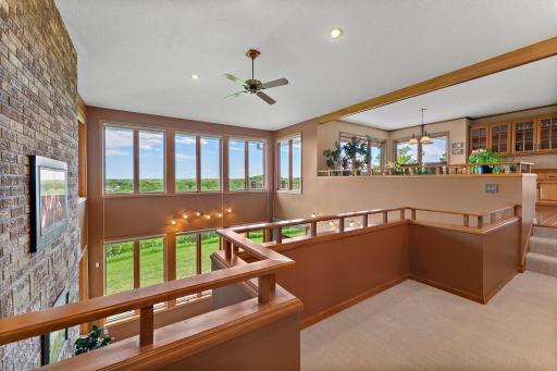 A view from the balcony overlooking the great room doesnât end there. The windows provide a panoramic view of the 93 acre estate that lies beyond, all the way to the lake.