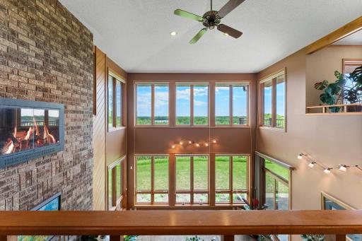 20â soaring ceilings and windows provide a view from all angles. Note the Full Height Masonry Fireplace too.