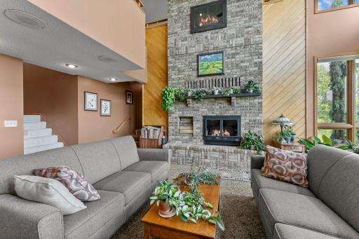 Floor to Ceiling Fireplace, the upper Firebox is visible in the Main Level Family Room, so clever!