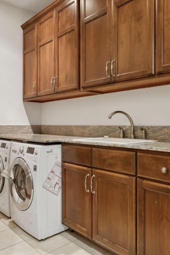 Convenient upper level laundry in the hallway next to the upper level bedrooms.