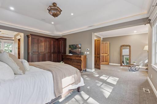 Solid panel French doors open to the owner's bedroom retreat.