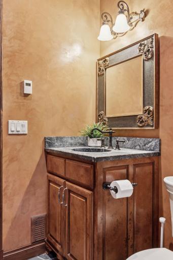 A half bathroom just off the mudroom coming in from the garage.