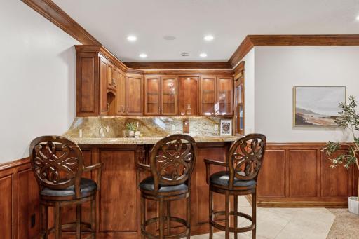 The wet bar with refrigerator and ice maker.