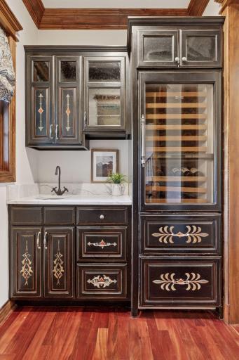 The butler's pantry located just off the kitchen with wine chiller.