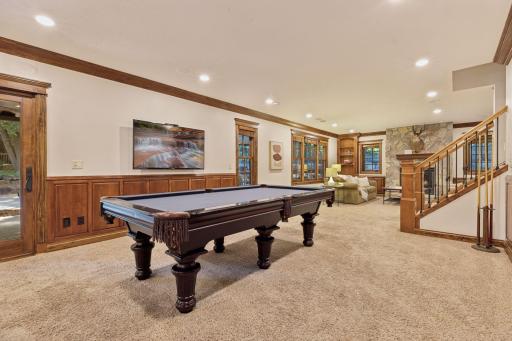 Desirable walkout lower level to the flagstone patio with brick exterior fireplace.