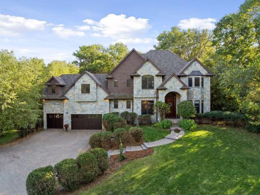 Welcome to this prestigious custom-built 2005 estate on 1.5 acres of private wooded grounds.