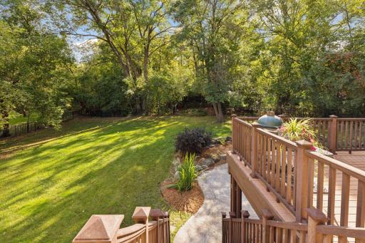You'll love the serene wooded setting in this prestigious rarely available Bloomington location.