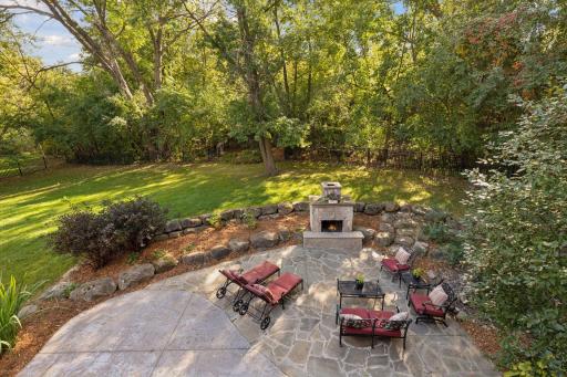View from the backyard deck overlooking the patio and forest.