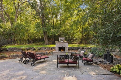 Exceptional outdoor living with flagstone and stamped concrete.