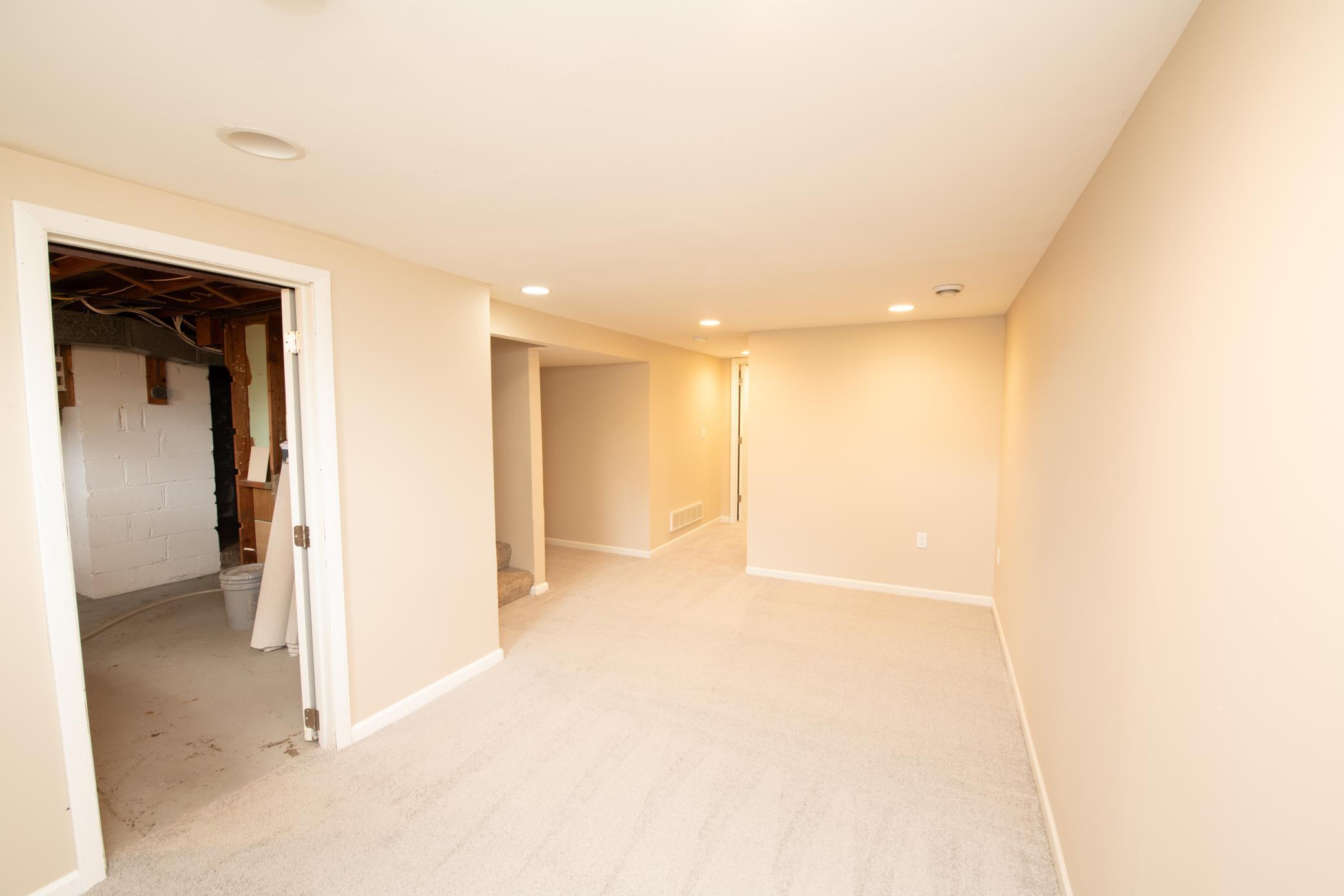 Basement offers a spacious family room, full bath, bedroom with egress, laundry room and storage area.