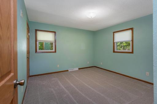 Generously sized primary bedroom with 1/2 bath ensuite
