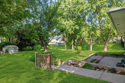 Lush landscaped and huge patio to enjoy the spacious yard