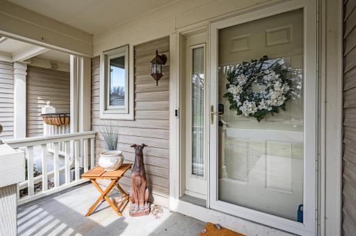 The front porch is warm and welcoming. As the weather warms, add some spring flowers for a pop of color.