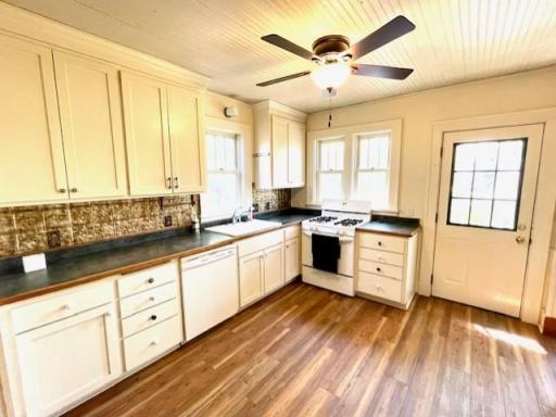 Large kitchen with bead board ceiling and all appliances stay