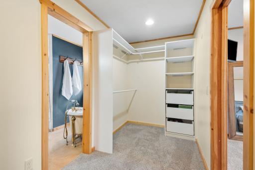 Walk in closet with organizational system