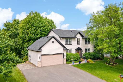 Wide driveway with room to park a third car next to garage or add a shed for even more storage!
