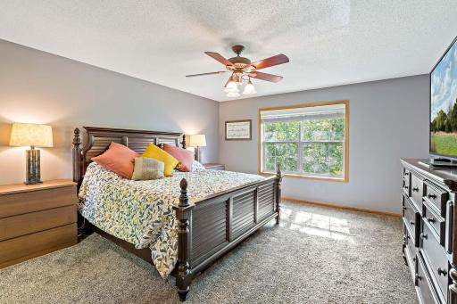 Primary bedroom on upper level with natural light pouring in