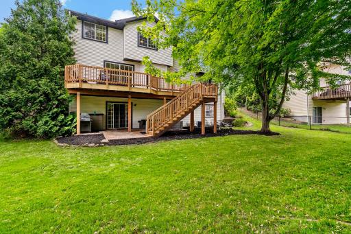 Room to entertain or relax on newly updated back patio with covered seating as well as a bon fire area