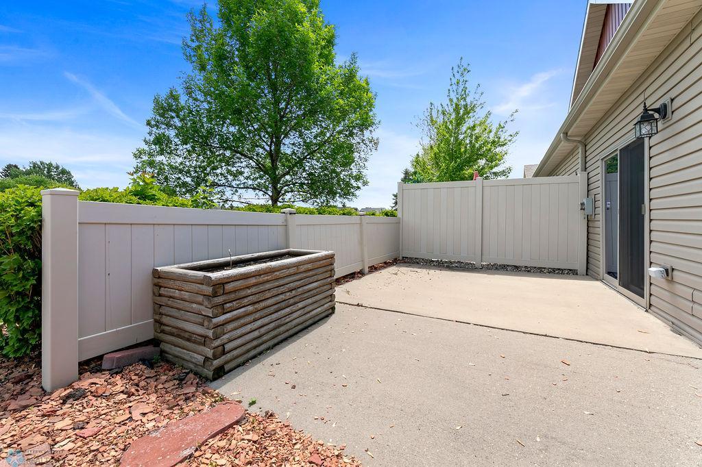 Large patio with privacy fence for relaxing or entertaining