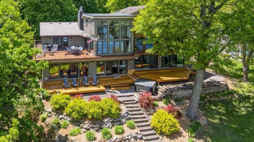 This is a home that's been heavily invested in and optimized to capture Minnetonka's natural beauty from every common space within the home and multiple gathering spaces on the lakeside.