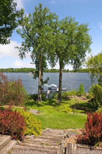 The lot slopes gently from house to shoreline.