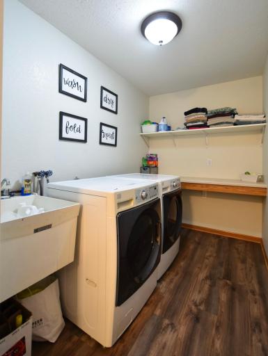 main floor laundry with sink & updated washer/dryer