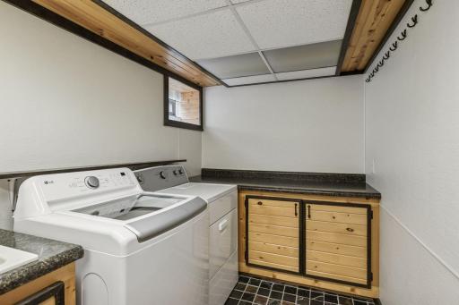 Great folding area and extra storage in your lower level laundry room.