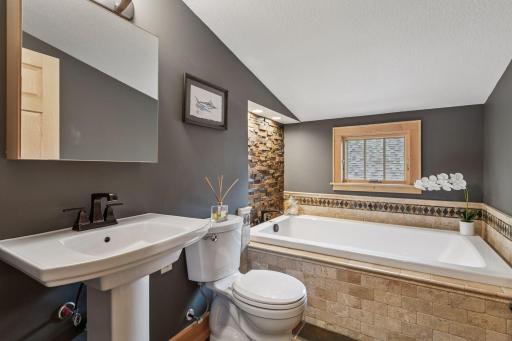 This spa-like bathroom is perfect to wrap up the night in your fabulous soaking tub!