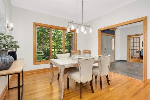 Large dining room with modern sconces and chandelier