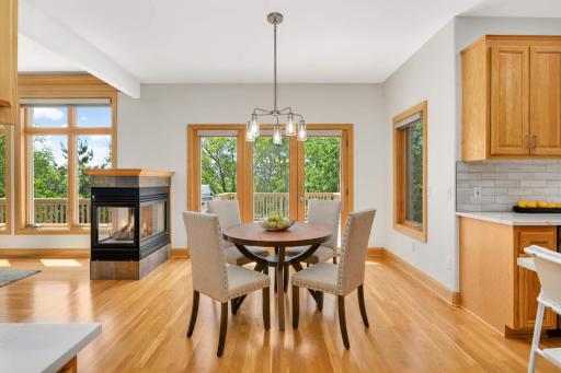 Eat-in kitchen with access to the deck and gas grill makes for effortless summer barbecues