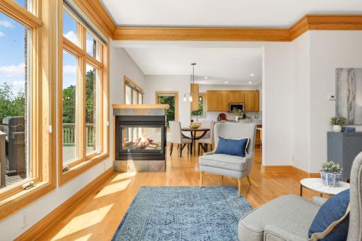 Cozy up to the three-sided gas fireplace with a book in the winter