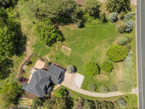 This expansive 3.5 acre lot can split into two parcels if desired, with room for another home