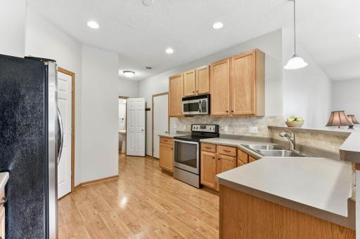 Plenty of storage and counter space in the kitchen with stainless appliances and neutral palette.