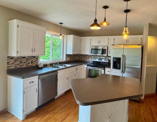 Kitchen has center island and center island