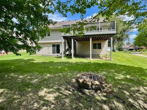 Have fun entertaining in this back yard with deck and fire pit