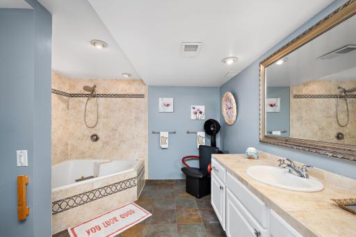 Spa-like bathroom with heated floors and corner, jetted tub!